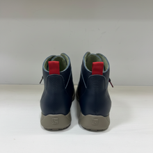 Load image into Gallery viewer, A pair of dark navy blue leather ankle boots shown from the back, featuring light gray soles and a green interior lining.
