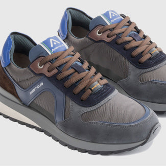 Gray and blue sneaker on a light gray background