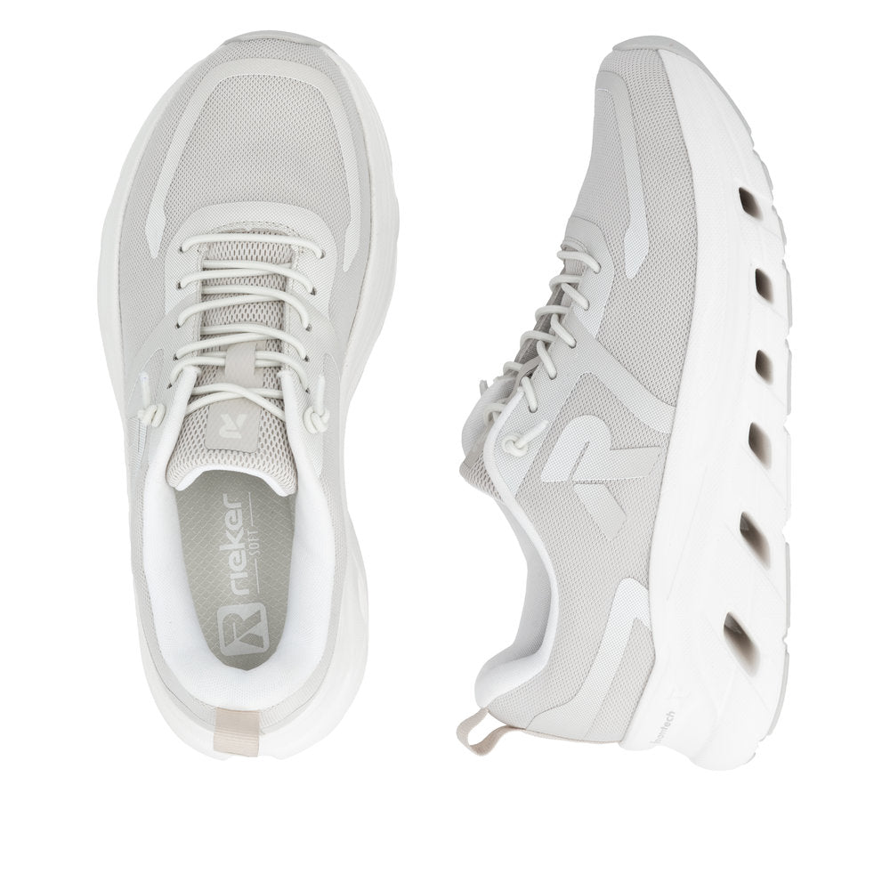 White sneakers with mesh design on a white background