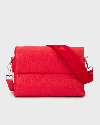 Red handbag with a strap on a light gray background