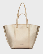 Load image into Gallery viewer, Gold handbag on a light gray background
