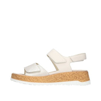 White sandal with cork platform on a white background