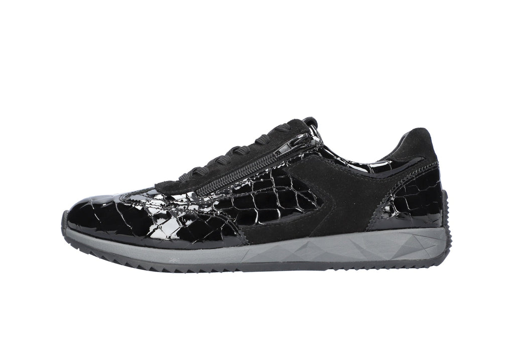 Black soccer shoe on a white background