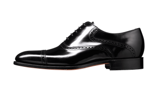 Shiny black dress shoe on a transparent background