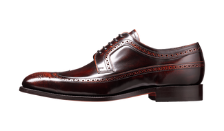 Brown leather dress shoe on a transparent background