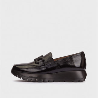 Black loafer shoe on a light gray background