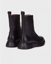 Load image into Gallery viewer, Pair of black leather boots on a light gray background
