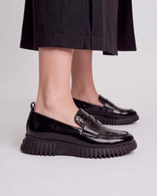 Load image into Gallery viewer, Wonders A4420 black patent and croc-effect loafers with chunky black soles, shown worn with dark trousers.
