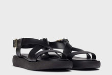 Load image into Gallery viewer, Black sandals on a light gray background
