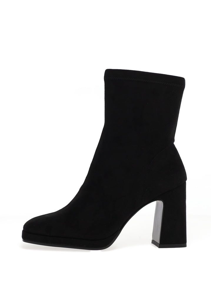 Black ankle boot with a block heel on a white background