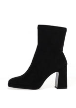 Load image into Gallery viewer, Black ankle boot with a block heel on a white background
