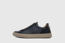 Load image into Gallery viewer, Navy blue sneaker with beige sole on a light gray background
