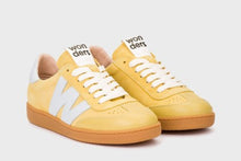 Load image into Gallery viewer, Yellow sneakers with white soles on a light gray background
