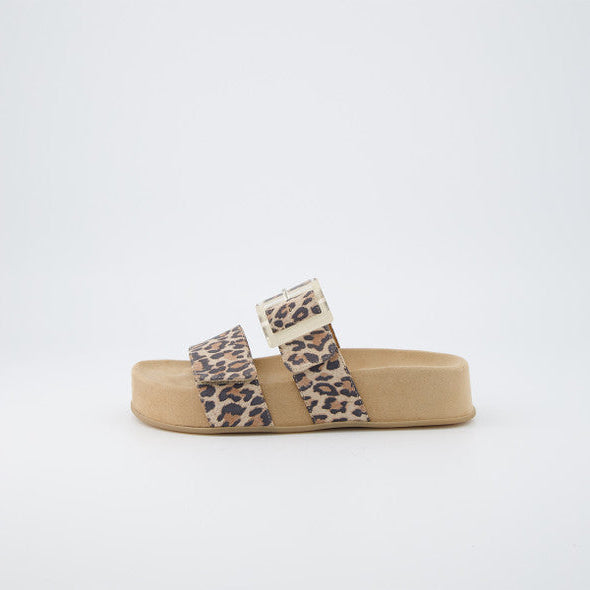 Beige slide sandal with leopard print straps on a white background