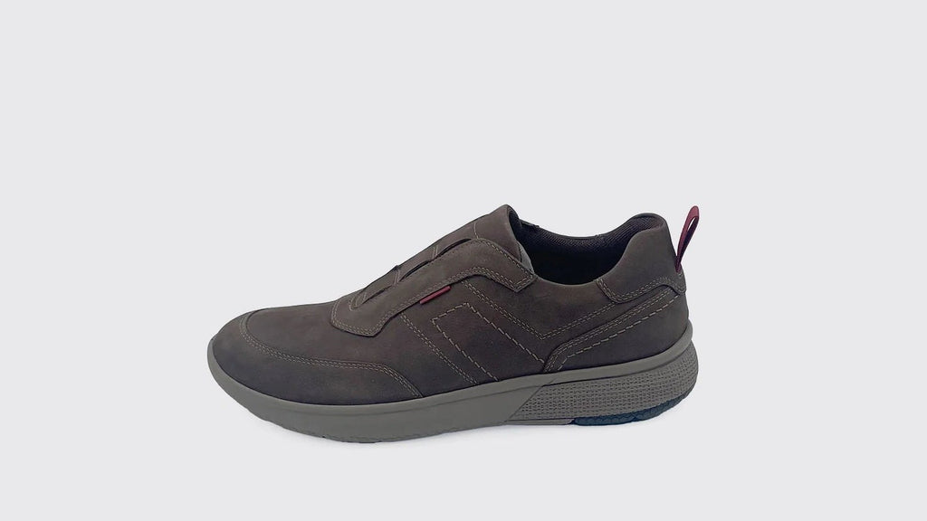 Brown slip-on shoe on a light gray background