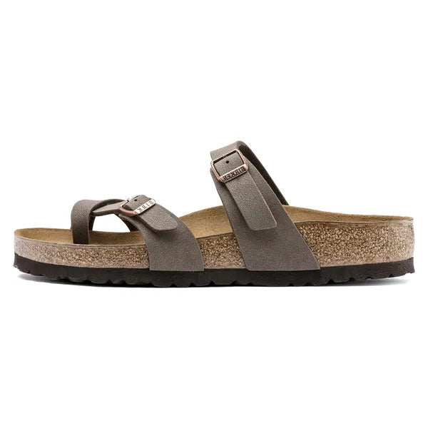 Brown sandal with a strap on a white background