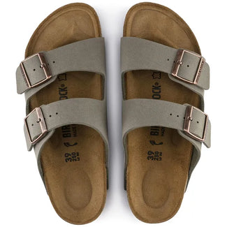 Gray sandal with brown buckles on a white background