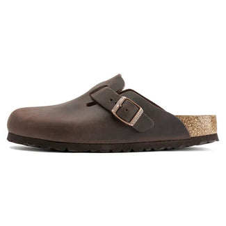 Brown clog shoe with cork sole on a white background