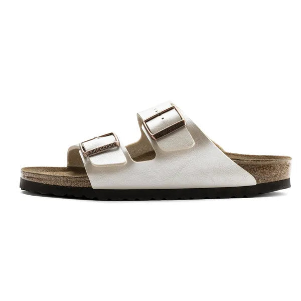 White sandal with two buckles on a white background