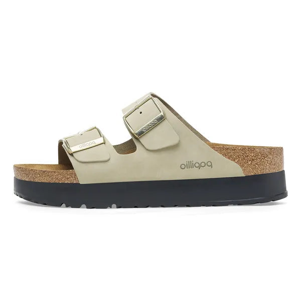 green sandal with cork sole on a white background