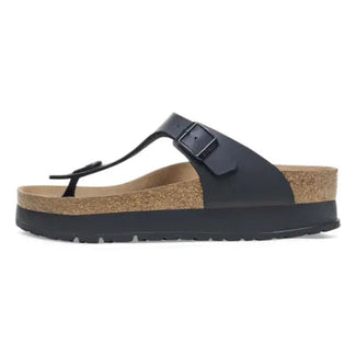 Black sandal with cork sole on a white background