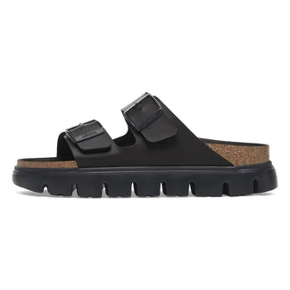 Black sandal with cork sole on a white background