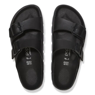 Black sandal with cork sole on a white background