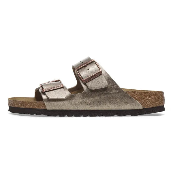 Birkenstock sandal with metallic buckle on a white background