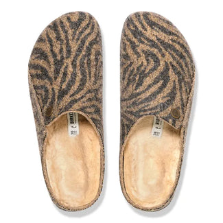 Zebra-patterned slipper on a white background