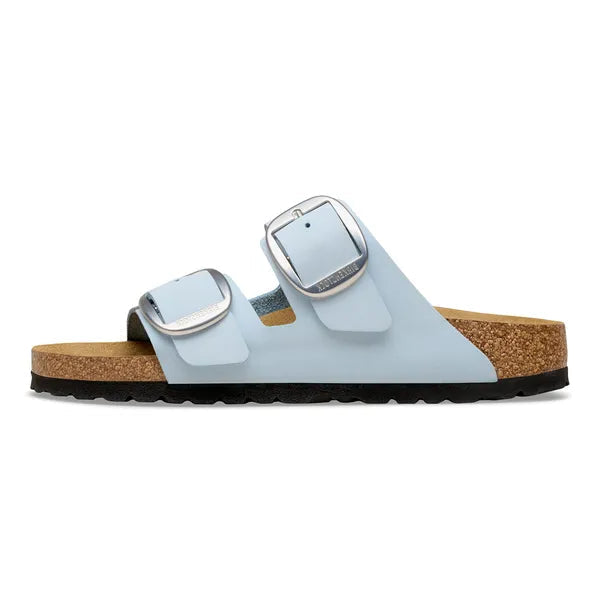 Light blue sandal with cork sole on a white background