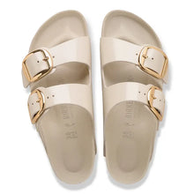 Load image into Gallery viewer, Beige sandals with gold buckles on a white background
