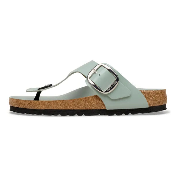 Light blue sandal with cork sole on a white background