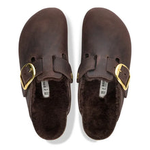 Load image into Gallery viewer, A pair of dark brown Birkenstock clogs with a plush brown faux fur lining and gold-tone buckle straps, shown from a top-down view on a white background.
