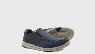 Navy blue shoe with beige accents on a white background