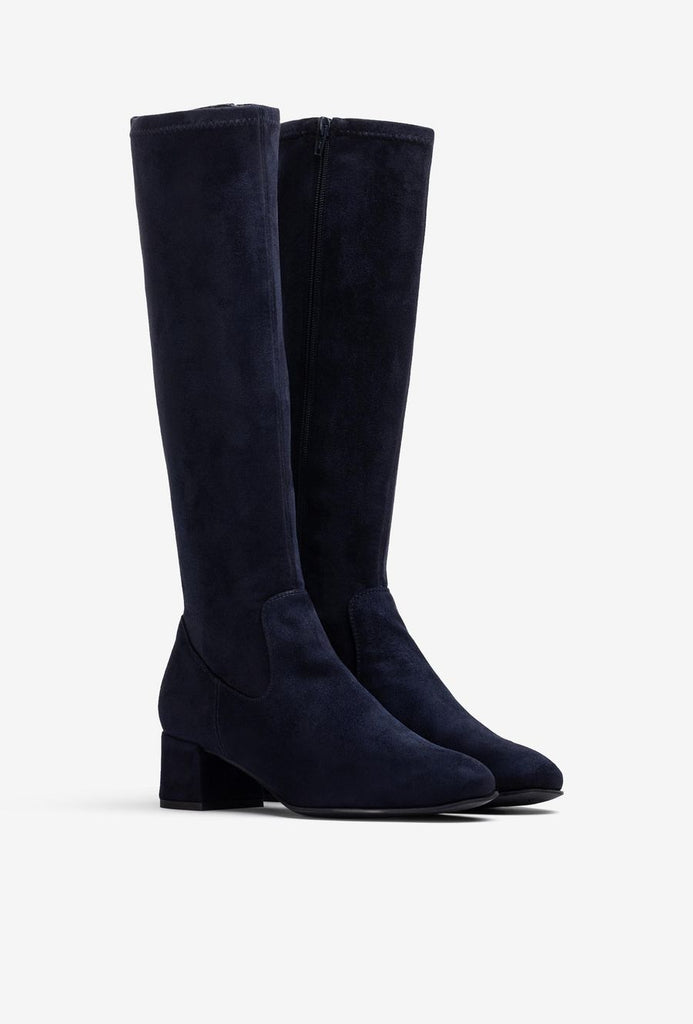 Pair of navy blue knee-high boots on a light gray background