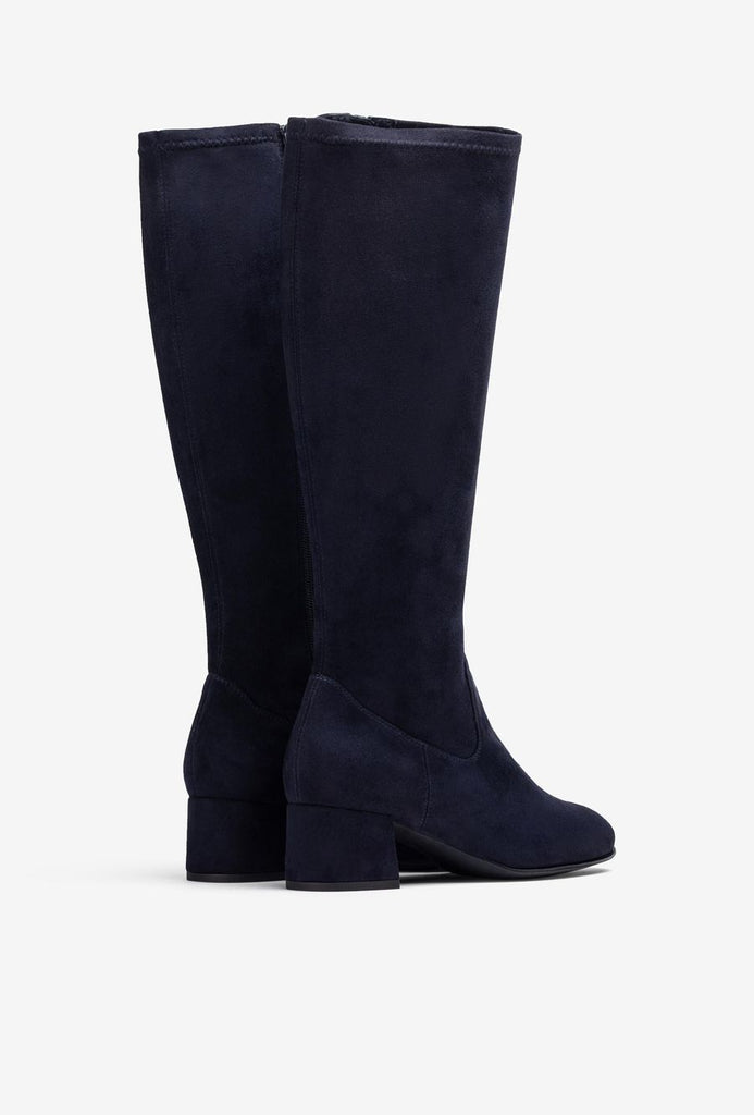 Pair of navy blue knee-high boots on a white background