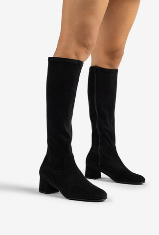 Black knee-high boot on a white background