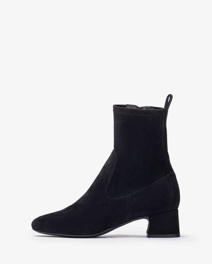Black ankle boot on a white background