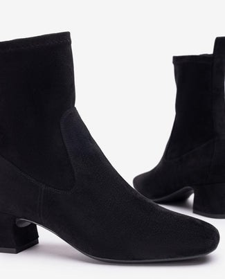 Black ankle boot on a white background
