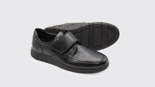 Load image into Gallery viewer, Black leather shoes with velcro straps on a light gray background
