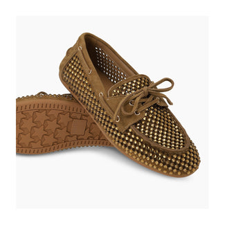 Brown suede loafer with studded details on a light gray background