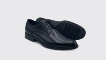 Load image into Gallery viewer, Pair of black leather dress shoes on a light gray background
