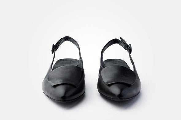 Pair of black sandals on a white background