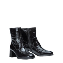 Load image into Gallery viewer, Black leather ankle boots on a white background

