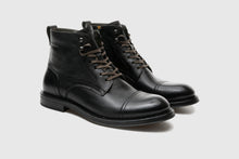 Load image into Gallery viewer, Pair of black leather boots on a light gray background
