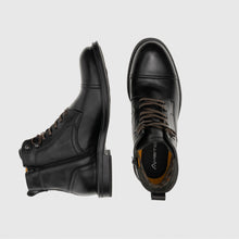 Load image into Gallery viewer, Black leather boots with a visible brand logo on a light gray background
