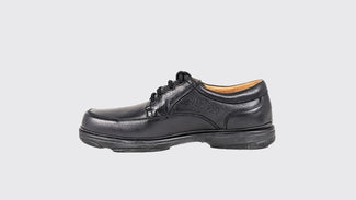 Black leather shoe on a light gray background
