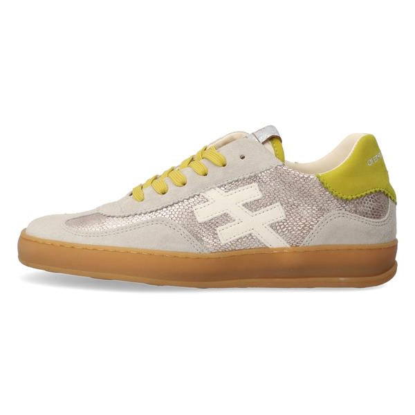Sneaker with yellow accents on a white background