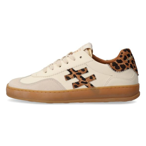 White sneaker with leopard print accents on a white background