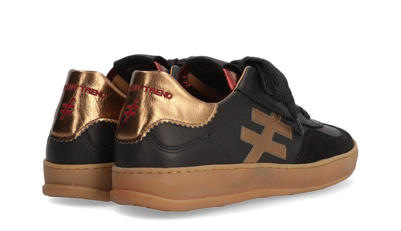 Another trend brown  sneakers with gold accents on a white background